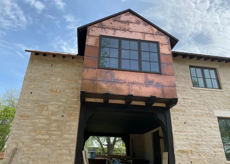 Copper metal panel facade on a stone building for Skylight Installation in Allegheny